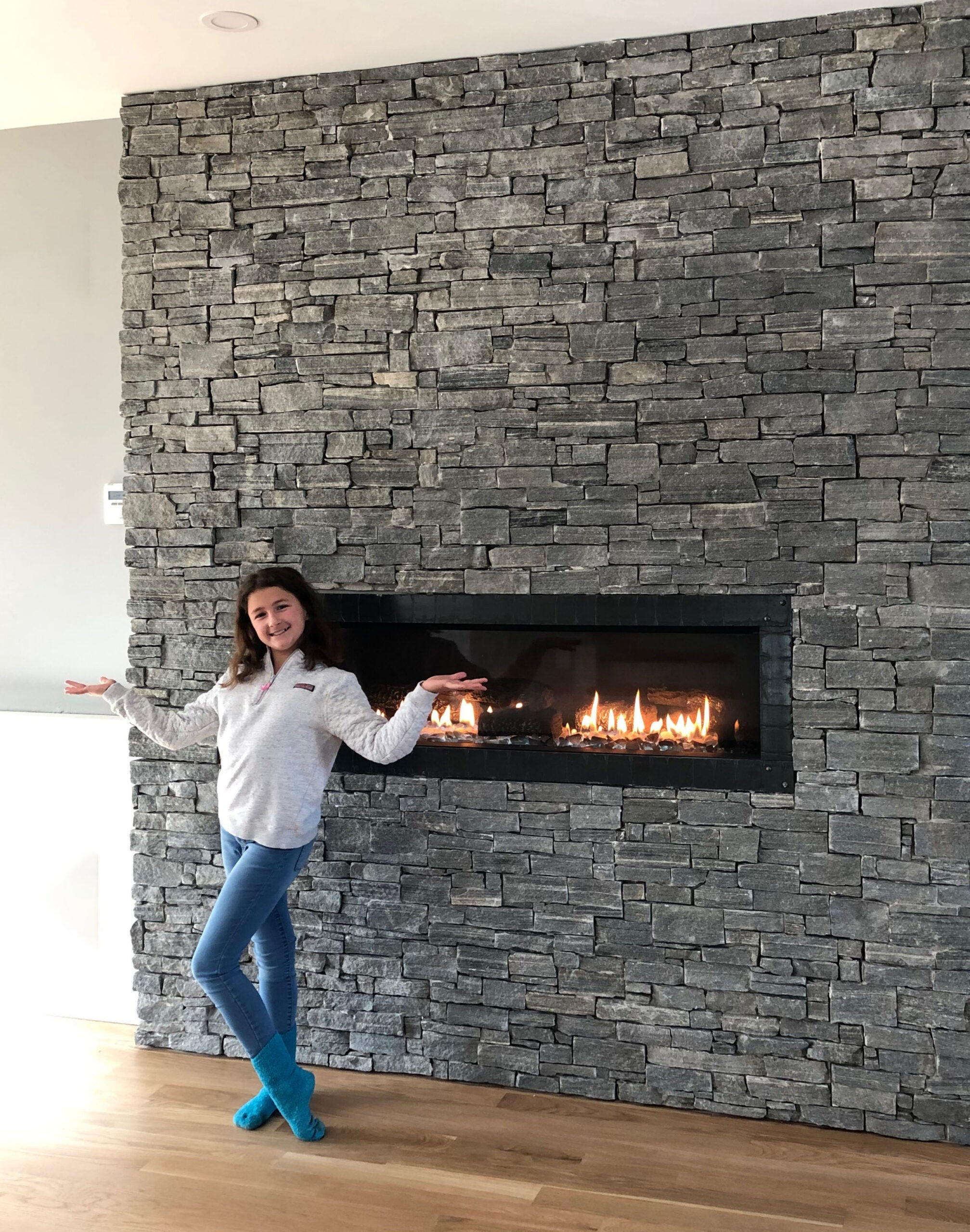 Interloc Natural Stone Veneer Panels are shown in Berkshire on this Fireplace.